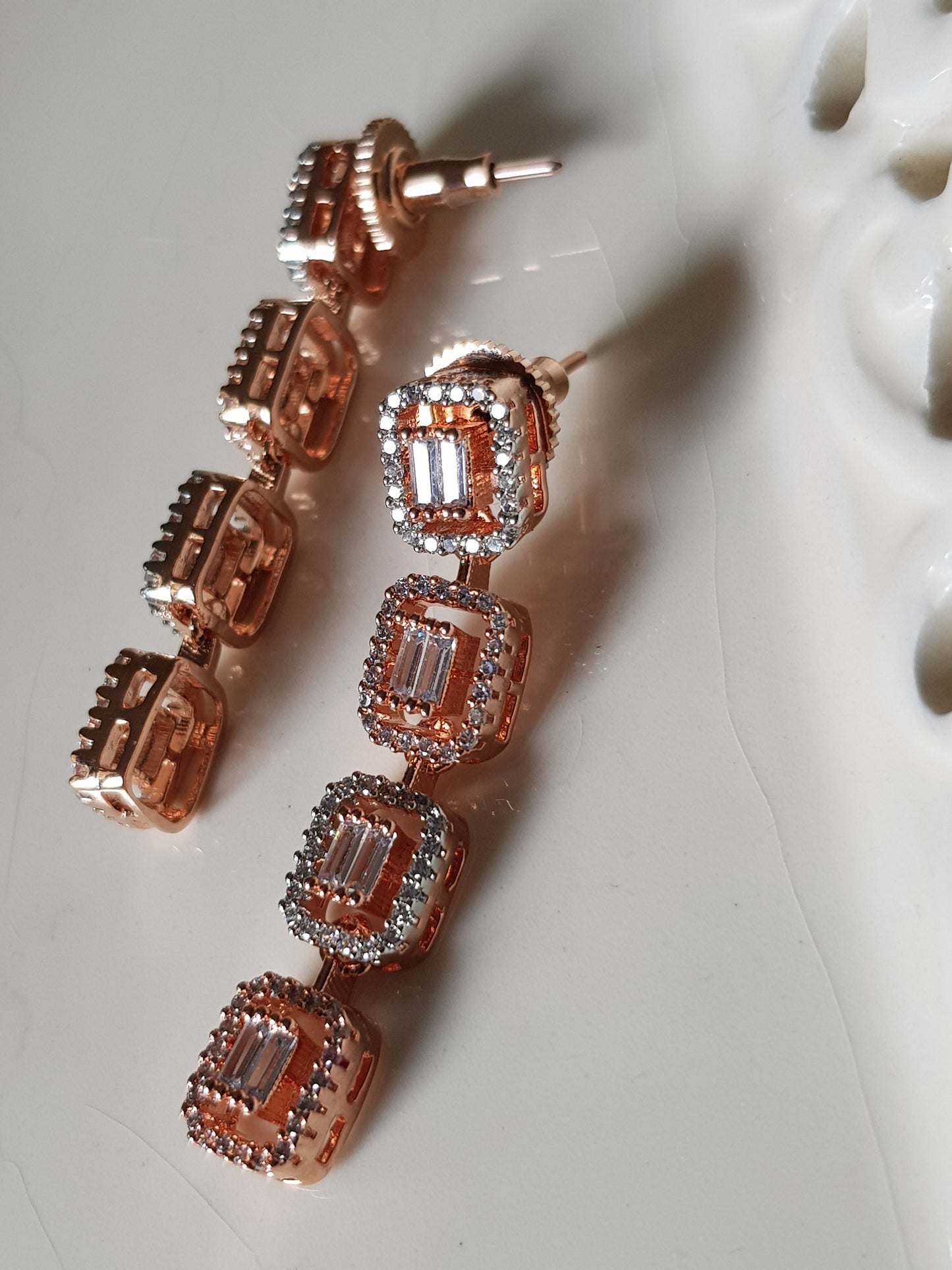 Rose gold/antique white and rose gold finish set in rectangular pattern CZ setting, matching danglers (earrings)