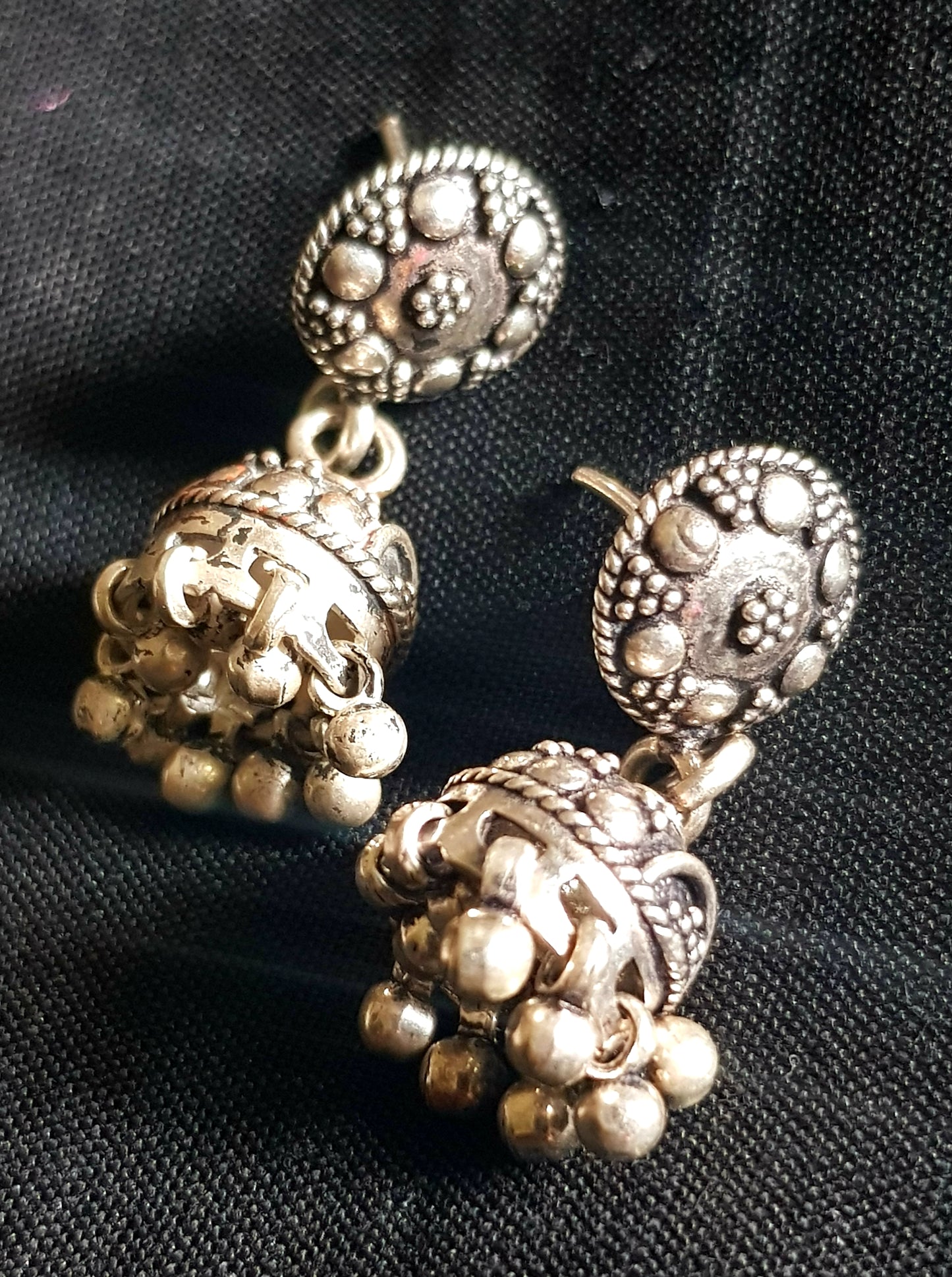 Silver jhumkis (earrings) with hanging beads on studs