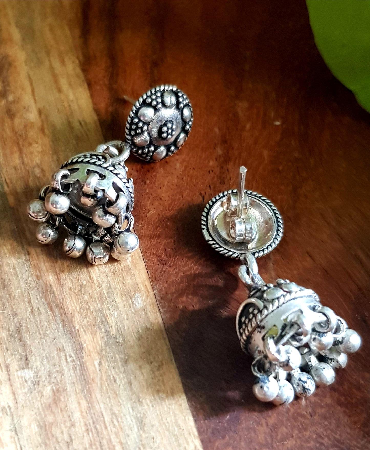 Silver jhumkis (earrings) with hanging beads on studs