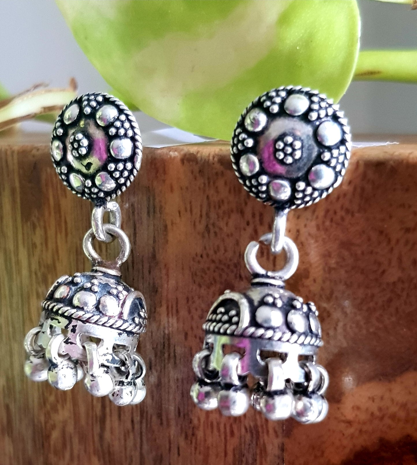 Silver jhumkis (earrings) with hanging beads on studs