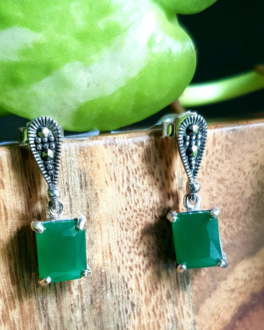 Silver earrings with square emerald stone hanging below teardrop shaped silver-marcasite stud