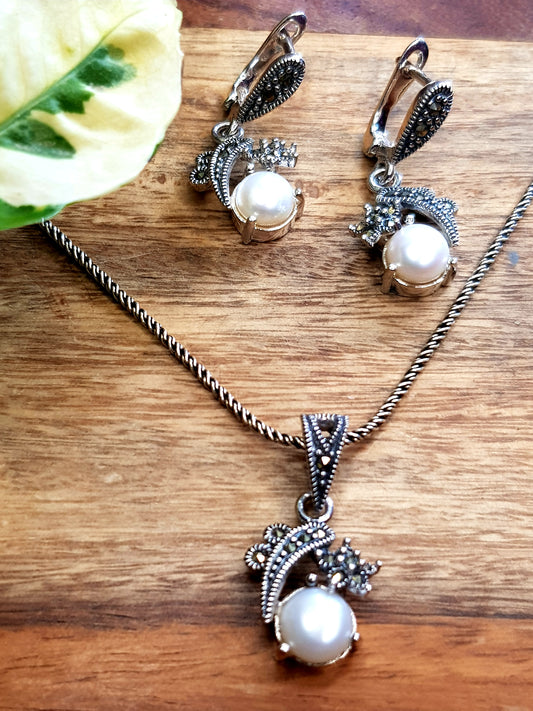 Silver pendant necklace and earrings set with pearls and marcasite