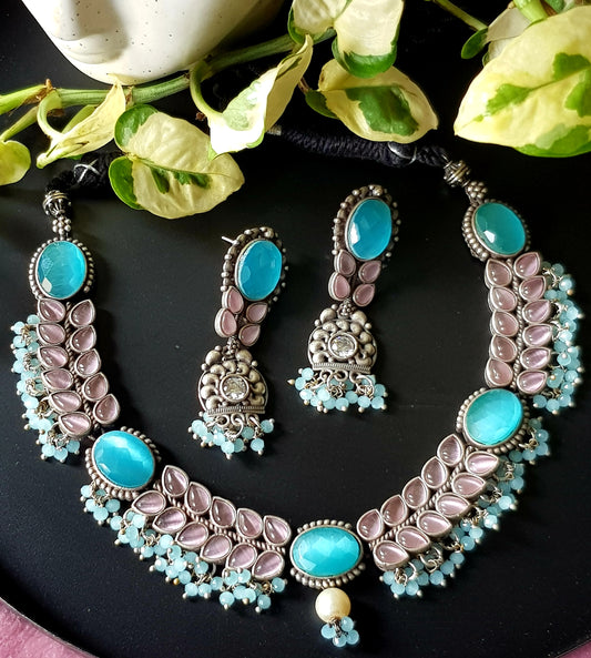 Silver finish set with choker necklace in turquoise/pale pink and blue stone matching long earrings