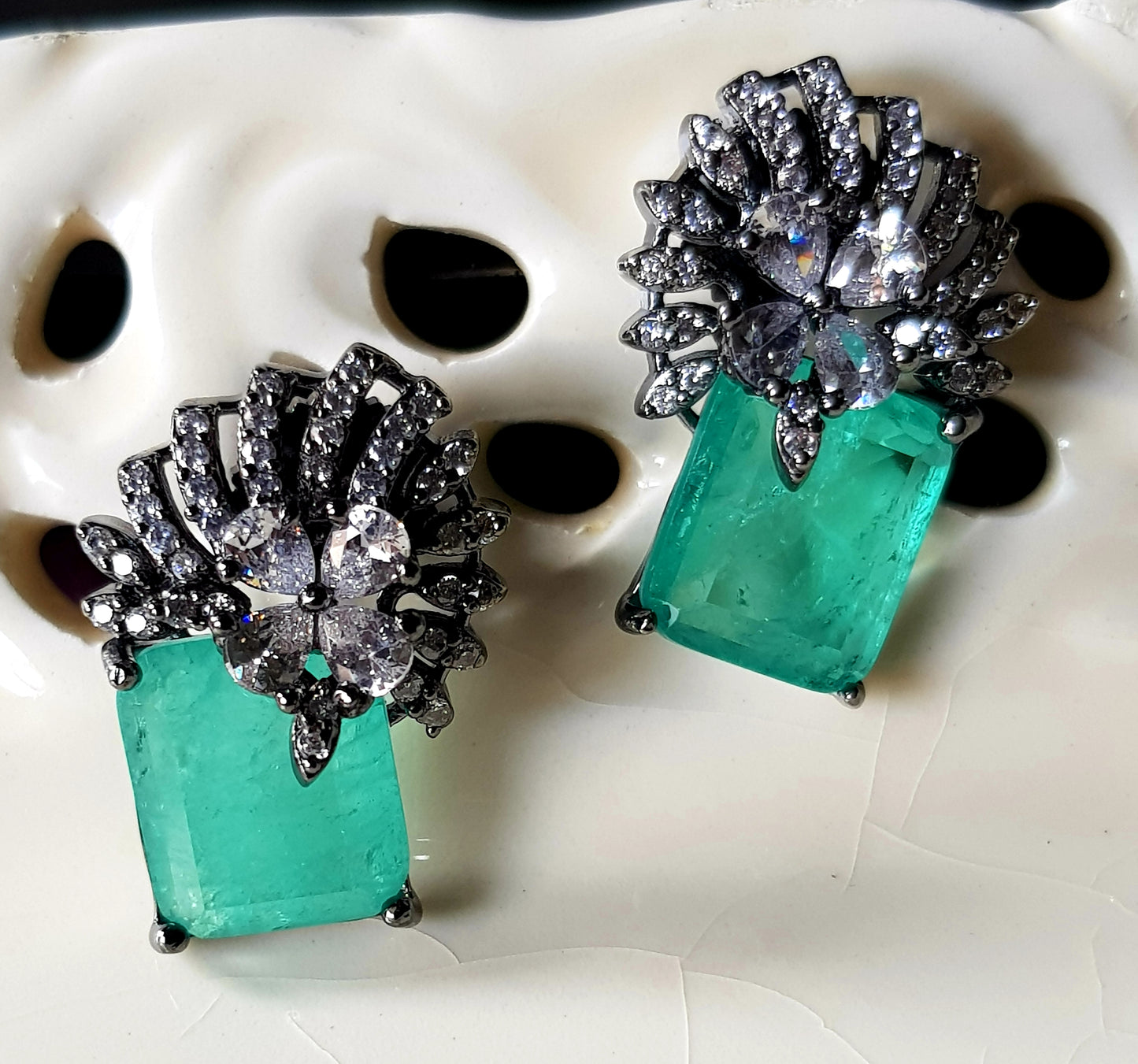 Victorian finish studs (earrings), teal green stone with flower design in CZ