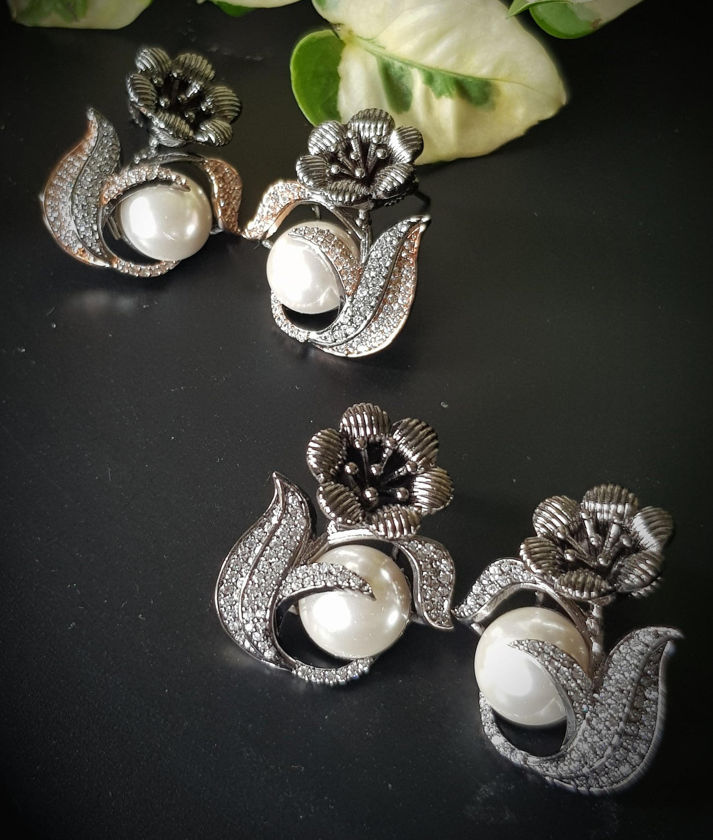 Antique platinum/rose gold finish studs (earrings), flower motif with a big pearl and CZ detailing