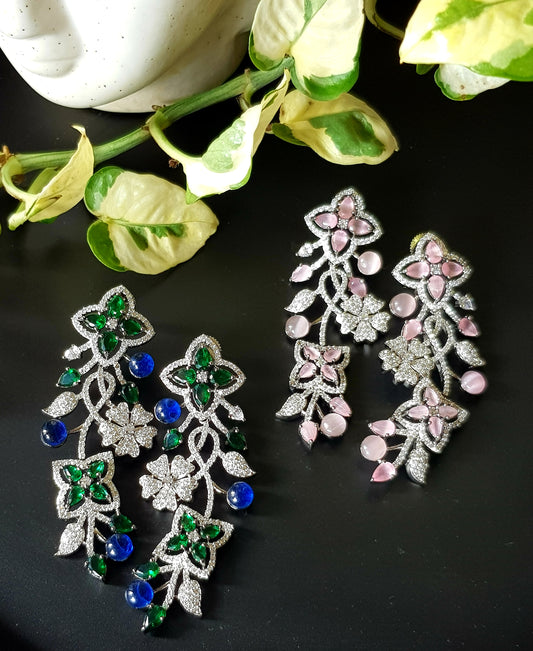 Platinum finish long studs (earrings), floral design in pale pink/sapphire and emerald stone detailing