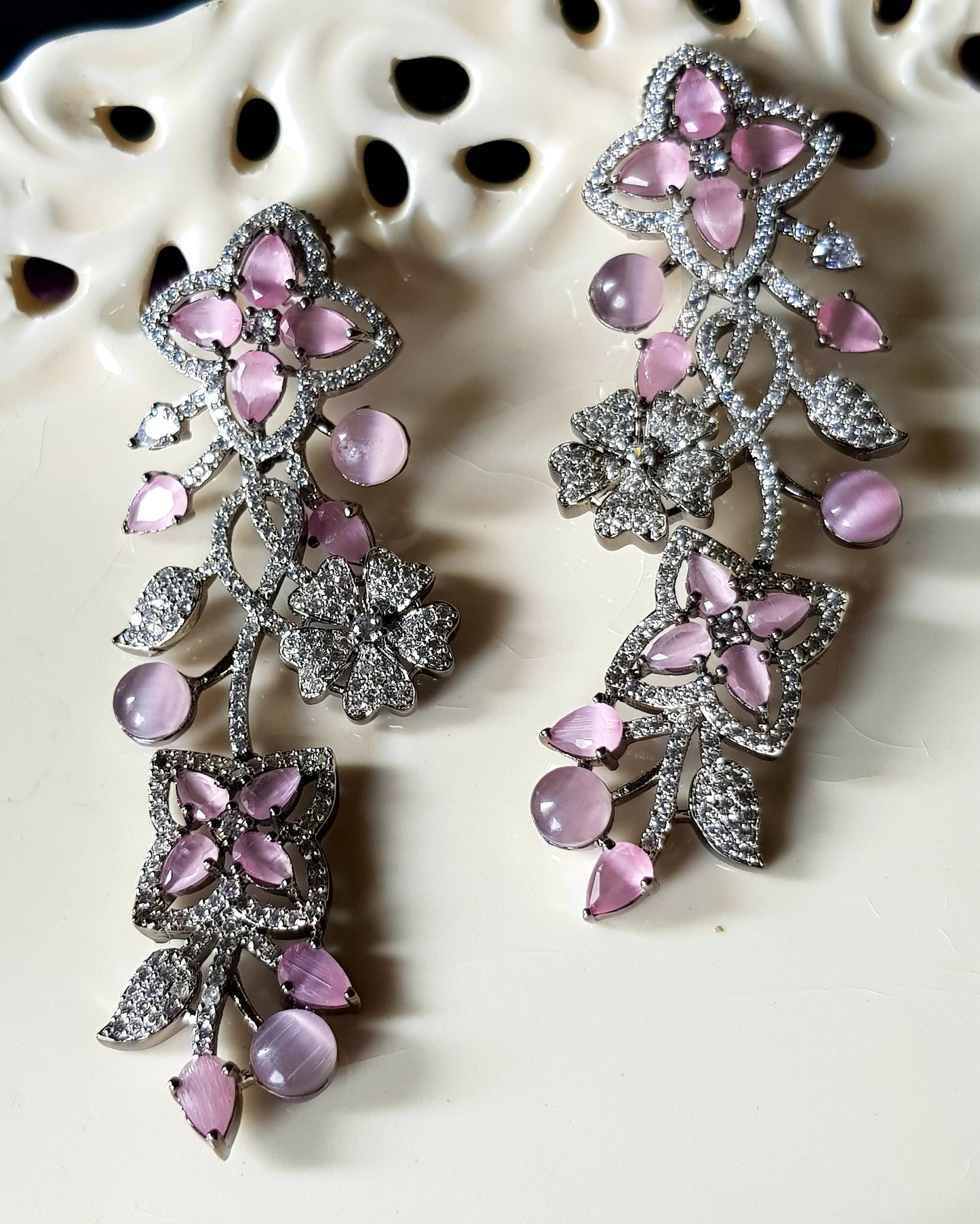 Platinum finish long studs (earrings), floral design in pale pink/sapphire and emerald stone detailing