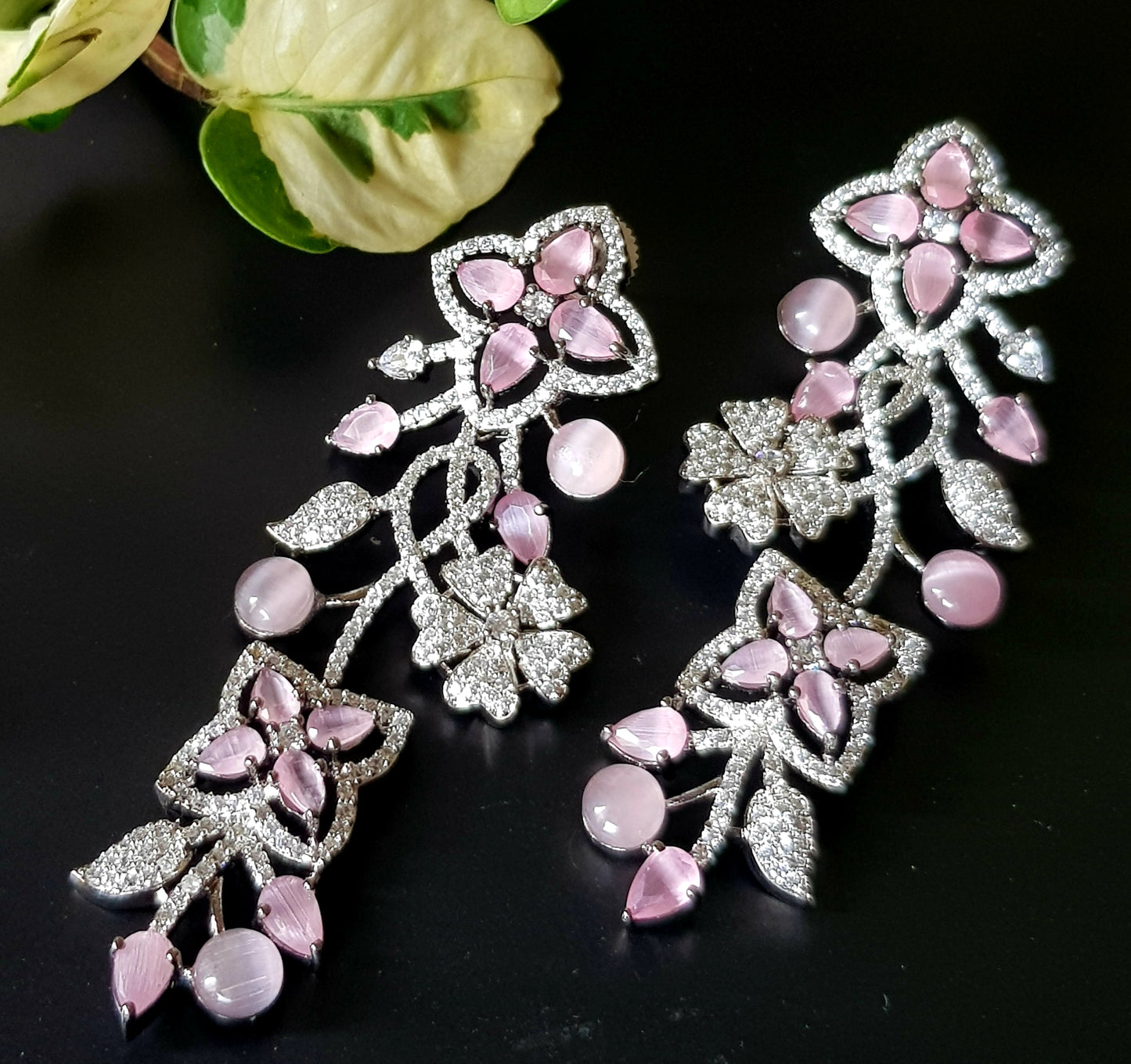 Platinum finish long studs (earrings), floral design in pale pink/sapphire and emerald stone detailing