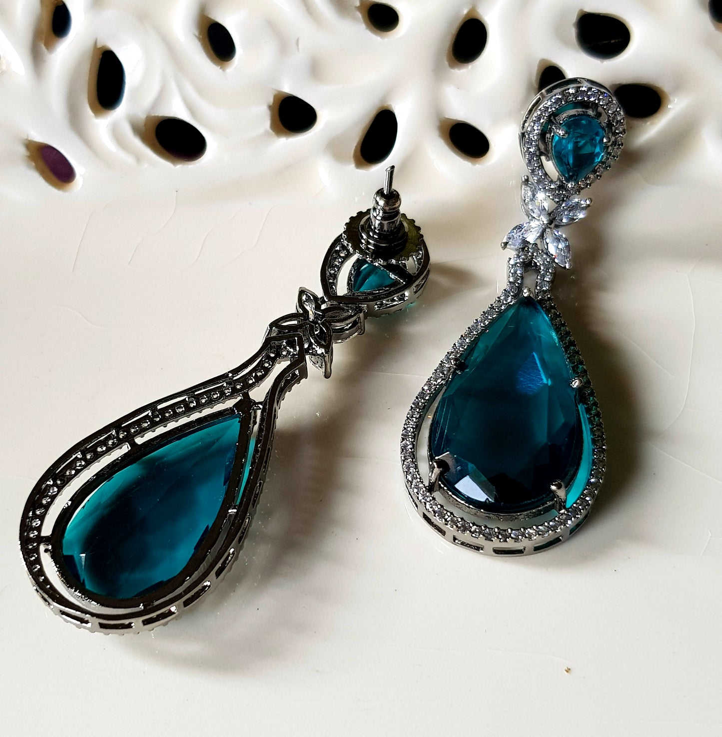 Antique finish long earrings with deep red/dark aqua blue stone and CZ detailing