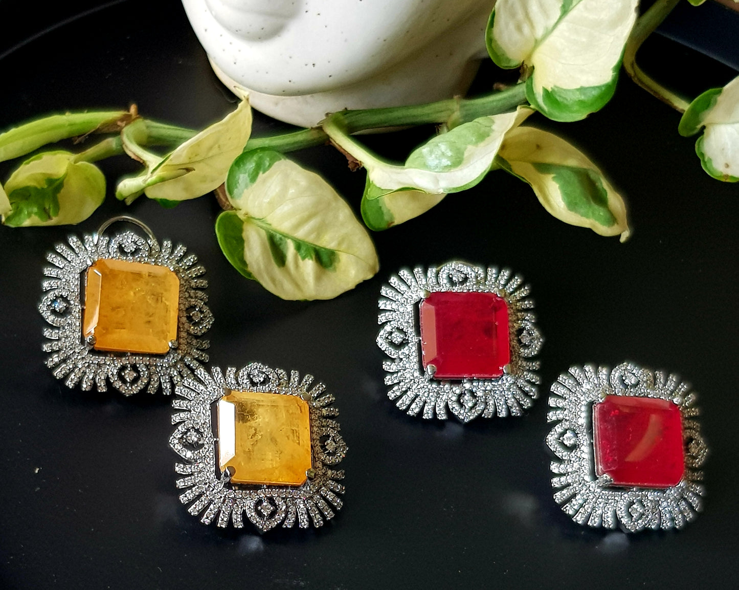 Antique finish studs (earrings), big ruby/topaz colour stone in the center with CZ detailing