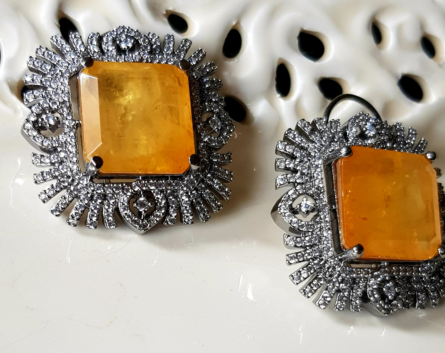 Antique finish studs (earrings), big ruby/topaz colour stone in the center with CZ detailing