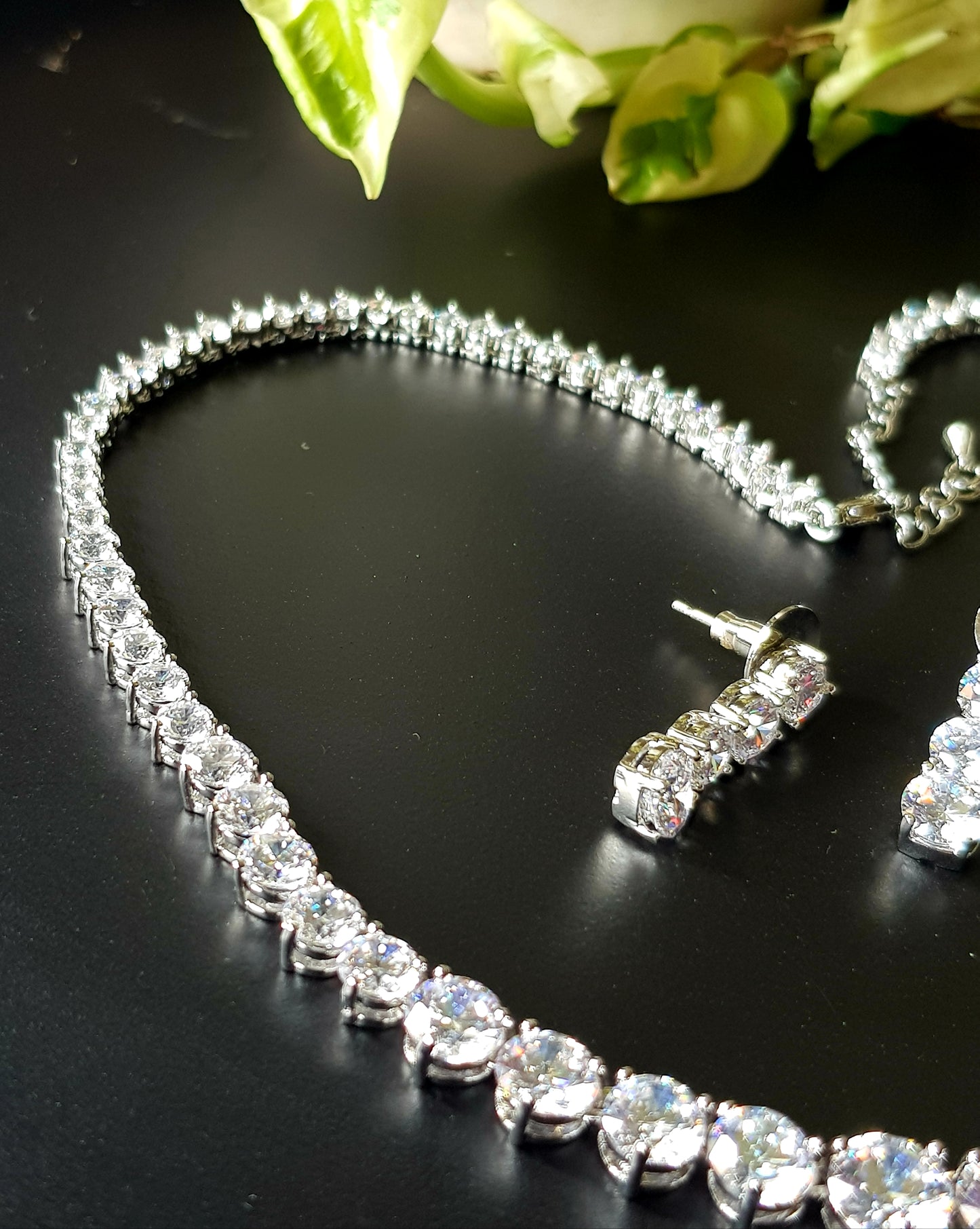 Platinum finish set, single CZ strand , matching earrings