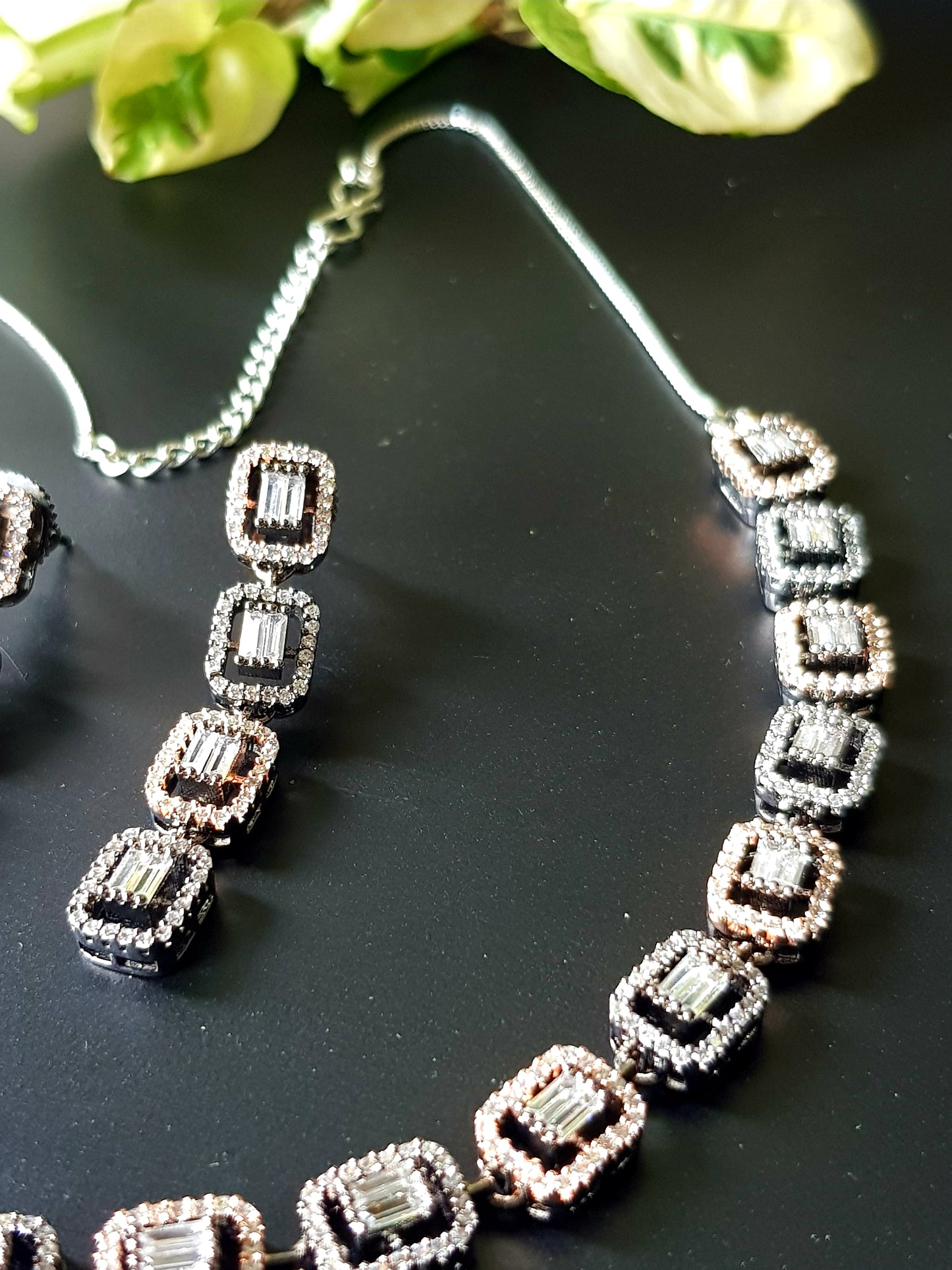 Rose gold/antique white and rose gold finish set in rectangular pattern CZ setting, matching danglers (earrings)