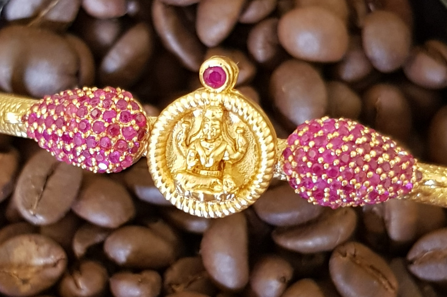 Temple jewelry gold finish bracelet with lakshmi motif and ruby stone detailing