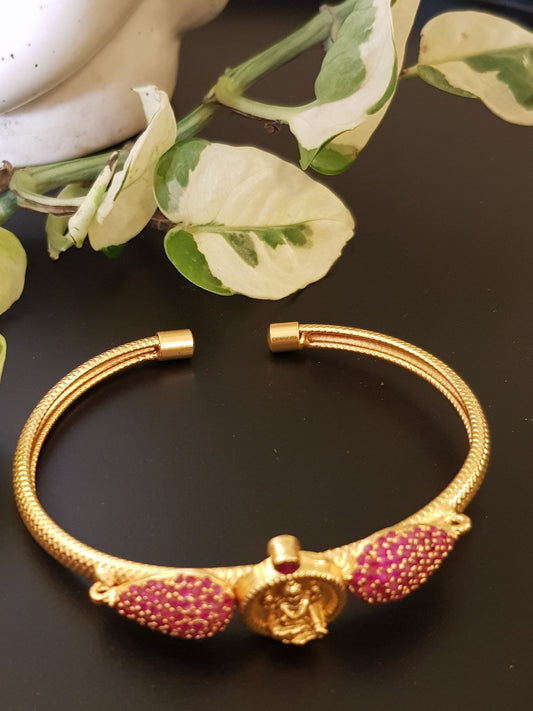 Temple jewelry gold finish bracelet with lakshmi motif and ruby stone detailing