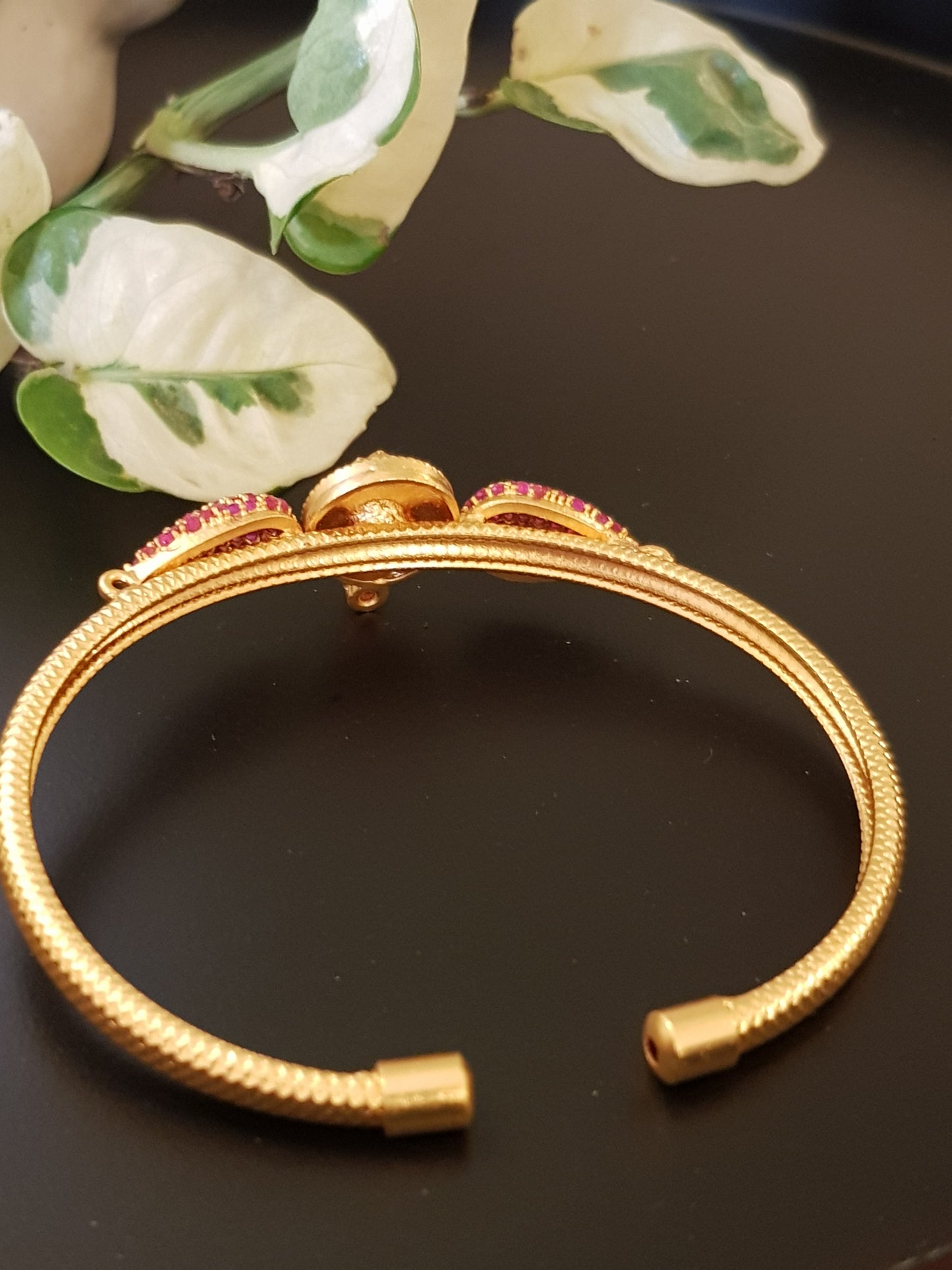 Temple jewelry gold finish bracelet with lakshmi motif and ruby stone detailing