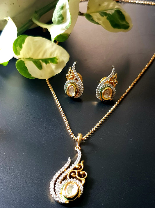 Gold finish pendant set, conch shell shape inspired pendant with kundan stone and embellished CZ, matching studs (earrings)