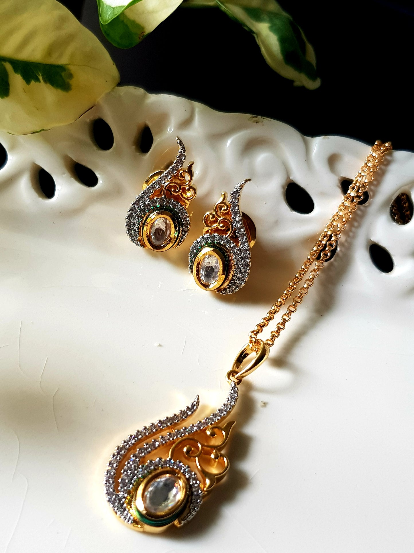 Gold finish pendant set, conch shell shape inspired pendant with kundan stone and embellished CZ, matching studs (earrings)