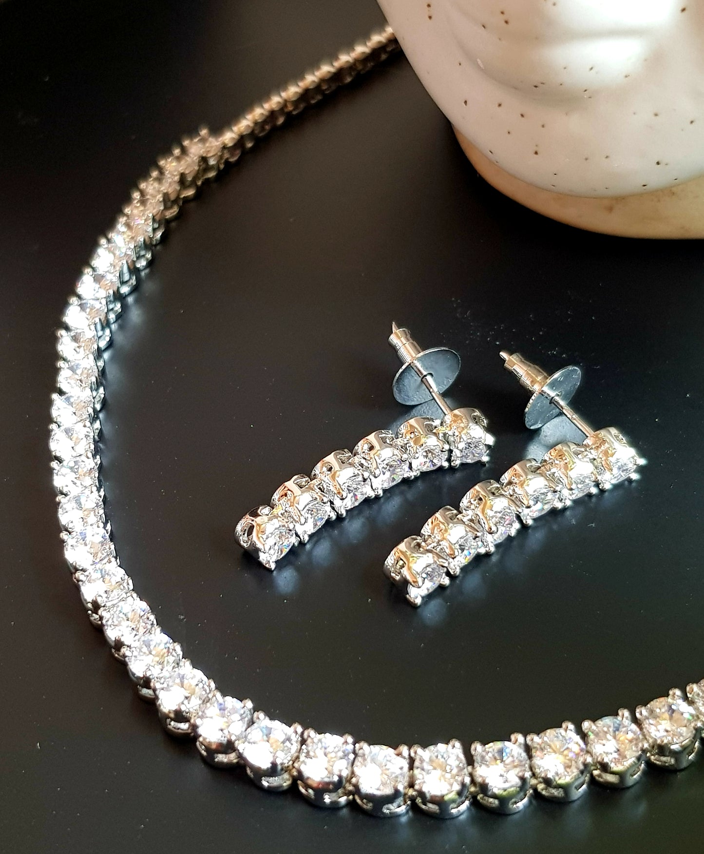 Platinum/gold/rose gold finish set, single CZ strand , matching earrings