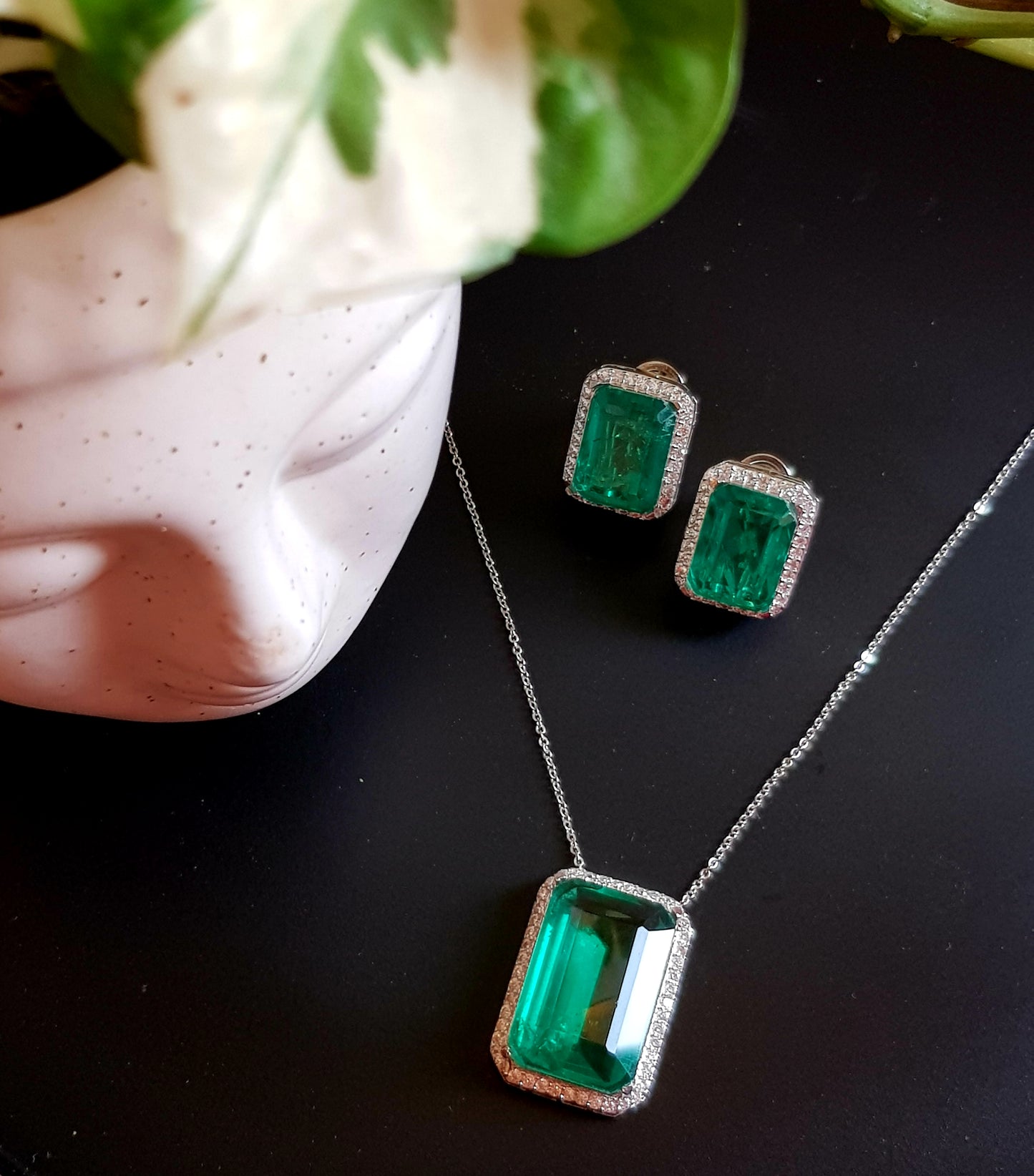 Platinum finish single stone emerald pendant set, matching studs (earrings)