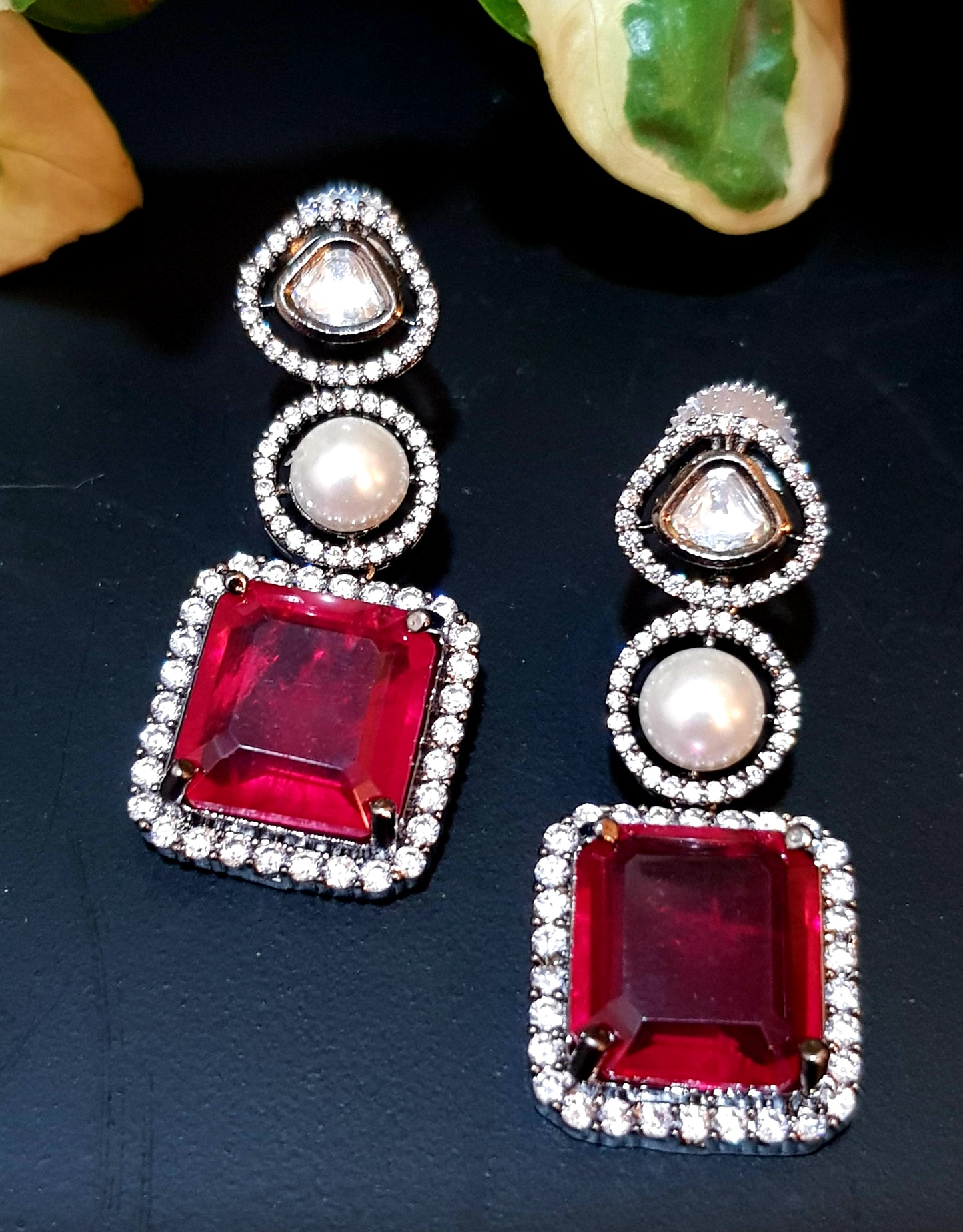 Antique silver finish set with square shaped ruby pendant on Kundan and pearl strand,matching earrings