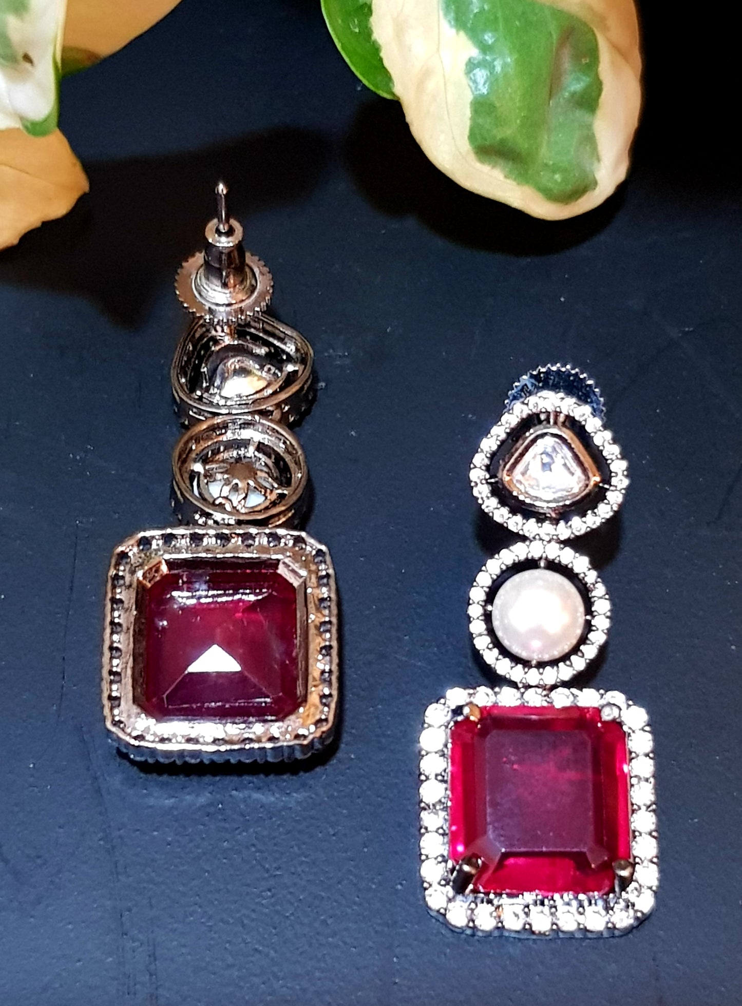 Antique silver finish set with square shaped ruby pendant on Kundan and pearl strand,matching earrings