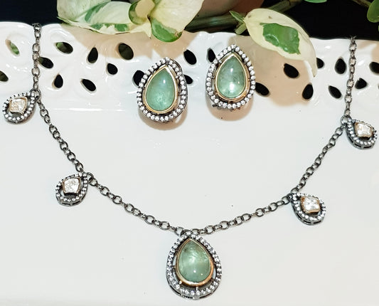 Antique finish set with pale green big pieces surrounded by CZ , matching studs (earrings)