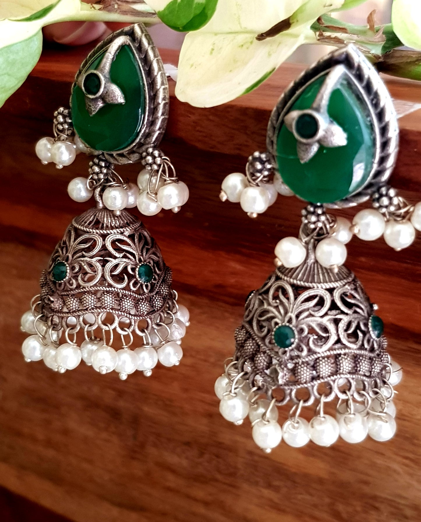 Silver finish jhumka (earrings), jaali designed dome under studs with green/white marble tearshaped stone