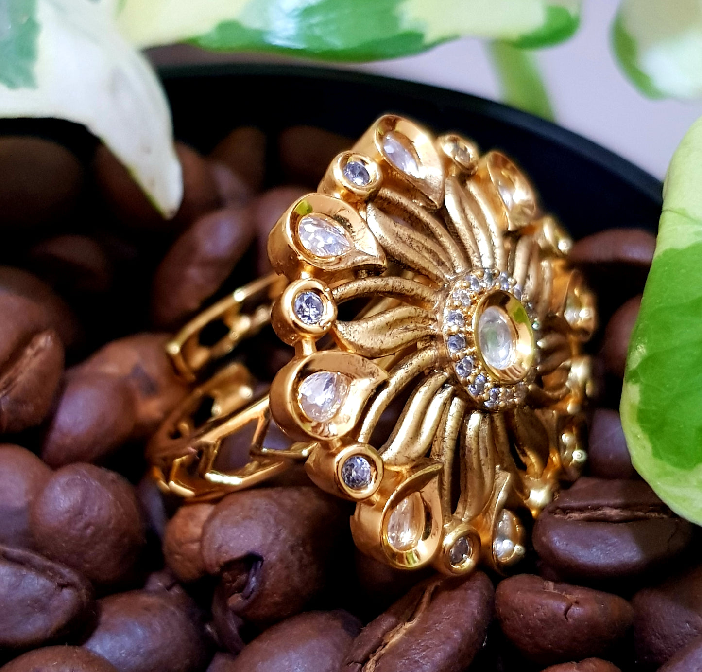 Gold finish flower motif ring with kundan stone and CZ detailing