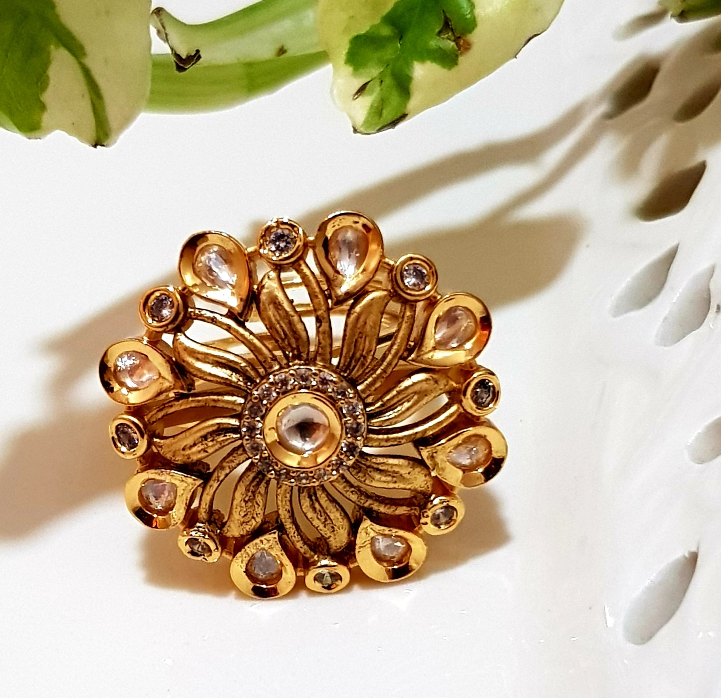 Gold finish flower motif ring with kundan stone and CZ detailing