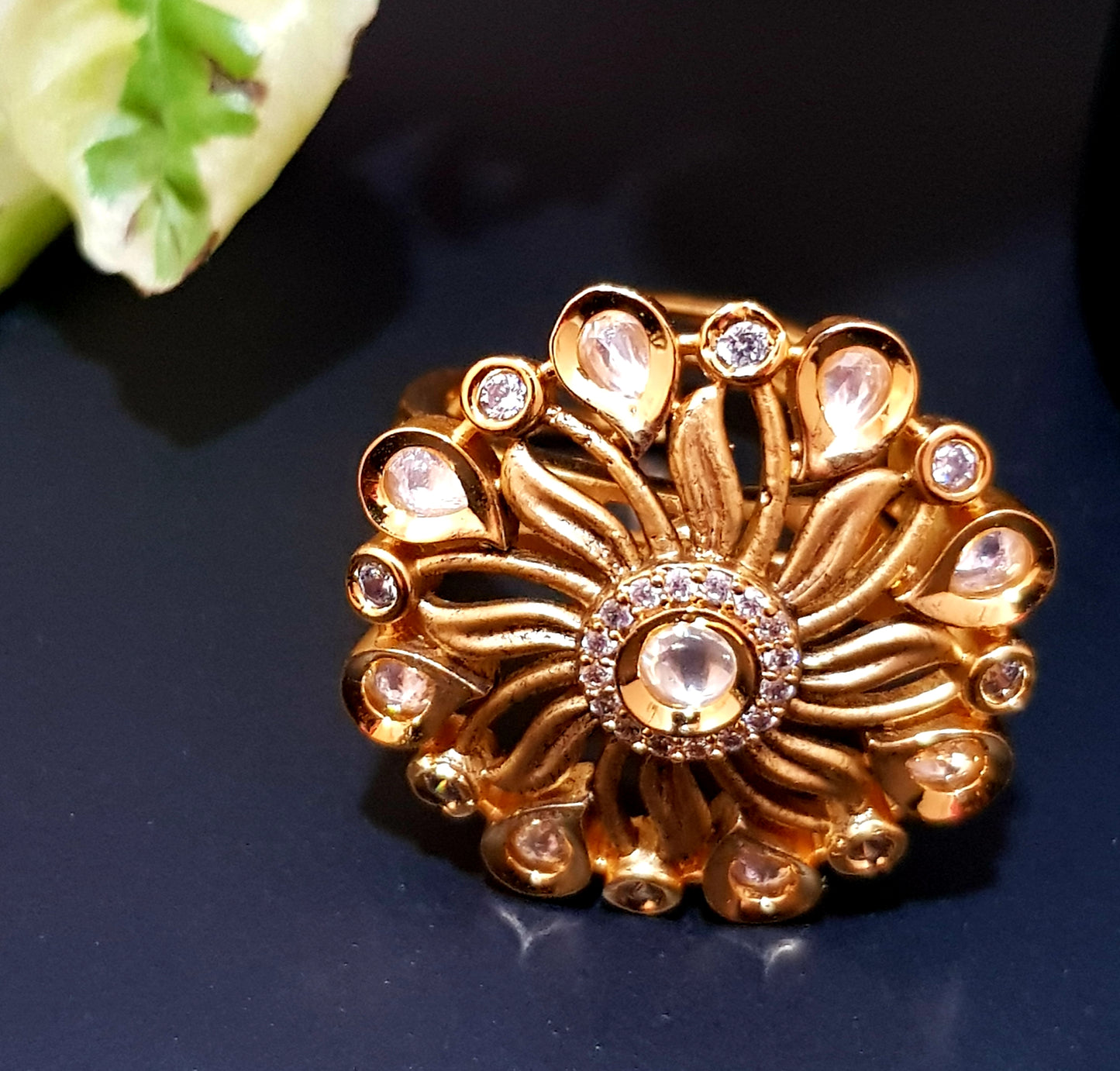 Gold finish flower motif ring with kundan stone and CZ detailing