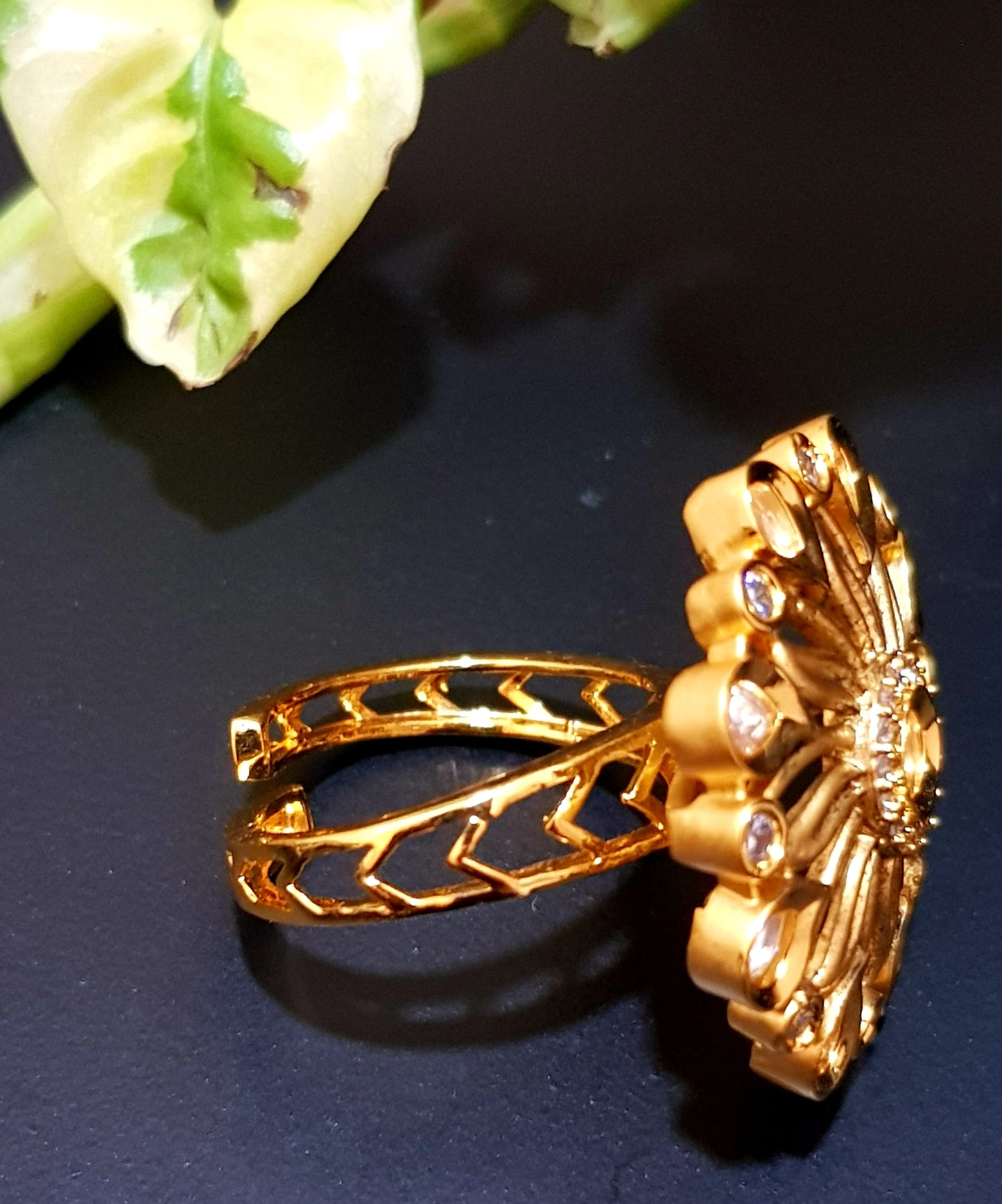 Gold finish flower motif ring with kundan stone and CZ detailing