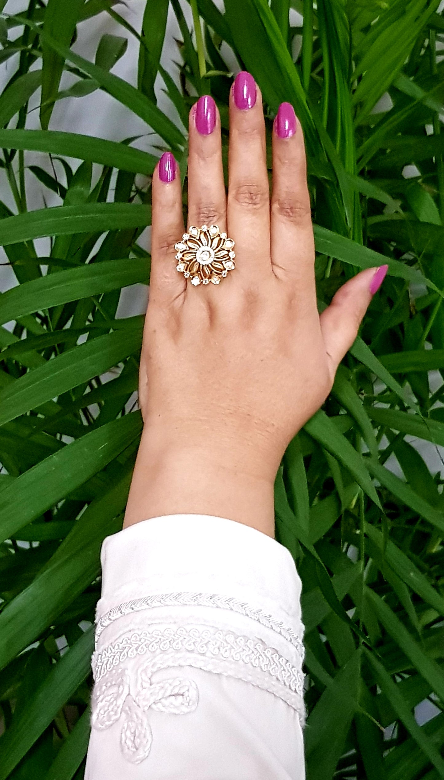 Gold finish flower motif ring with kundan stone and CZ detailing