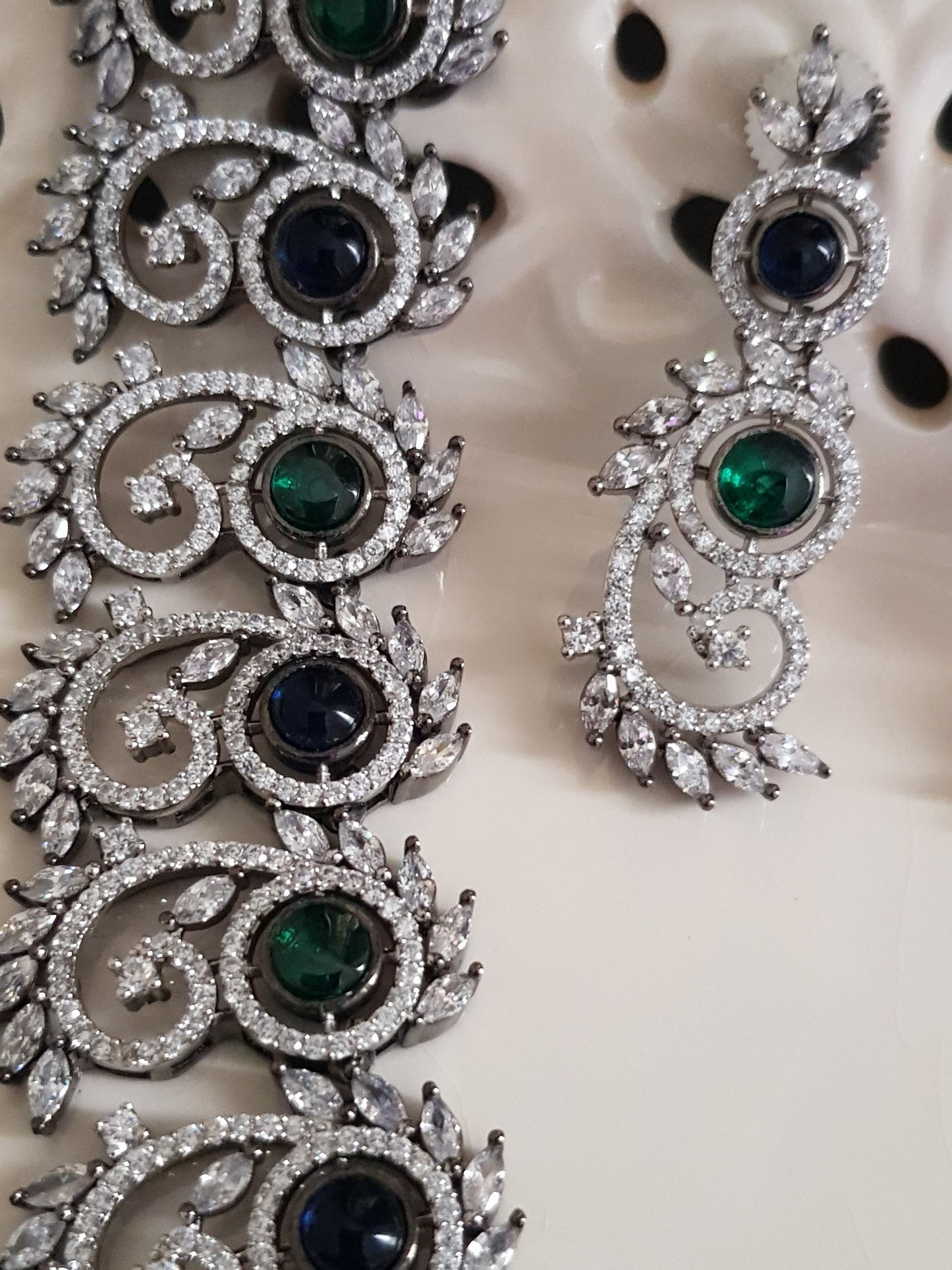 Silver Finish set with elongated C shaped pieces with emerald/sapphire and CZ detailing , matching earrings