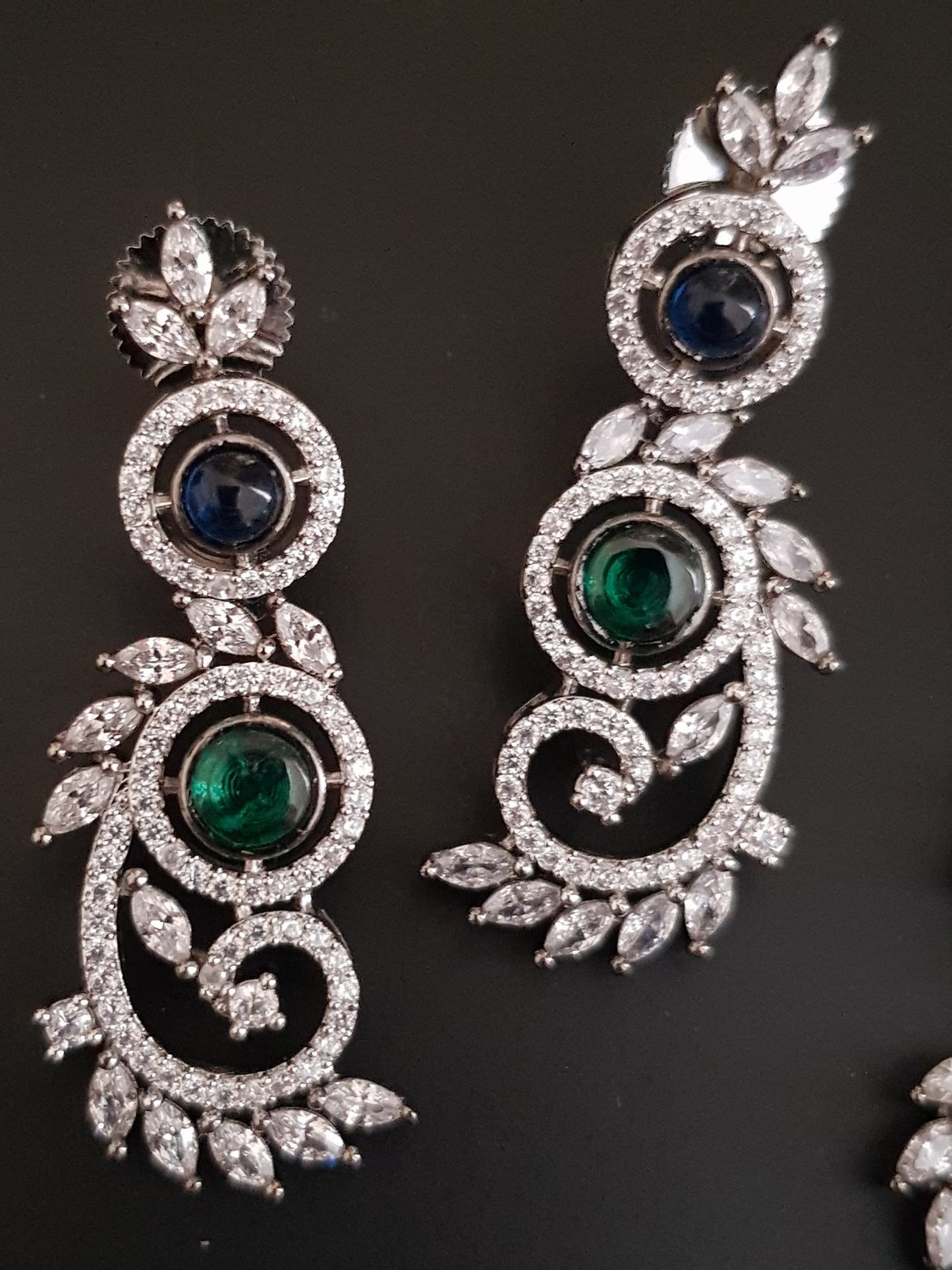 Silver Finish set with elongated C shaped pieces with emerald/sapphire and CZ detailing , matching earrings