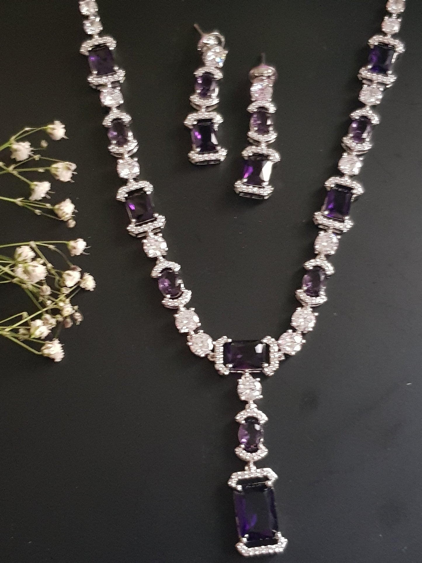 Platinum finish set, amethyst and CZ stones, set in single strand long necklace, matching earrings