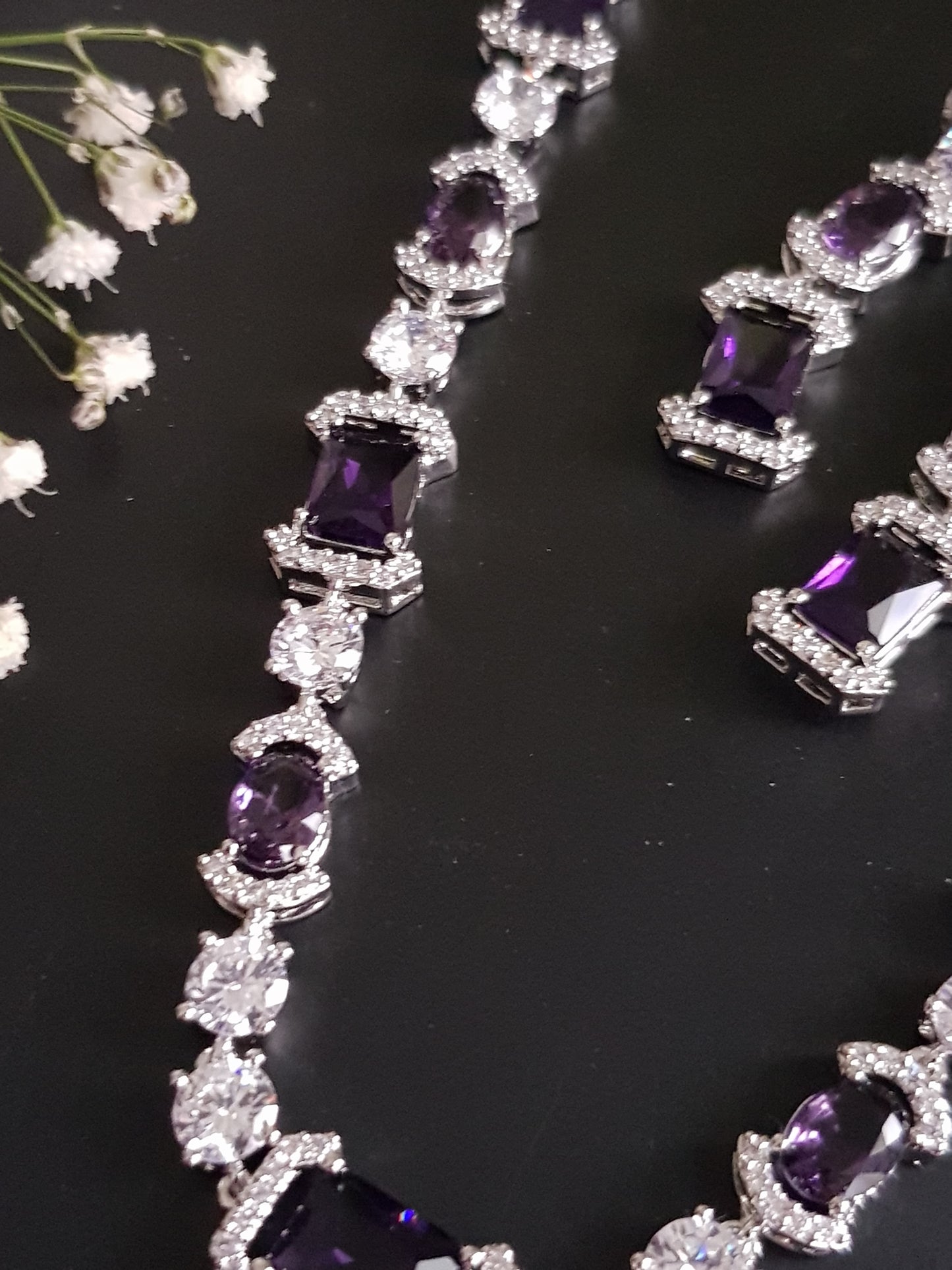 Platinum finish set, amethyst and CZ stones, set in single strand long necklace, matching earrings