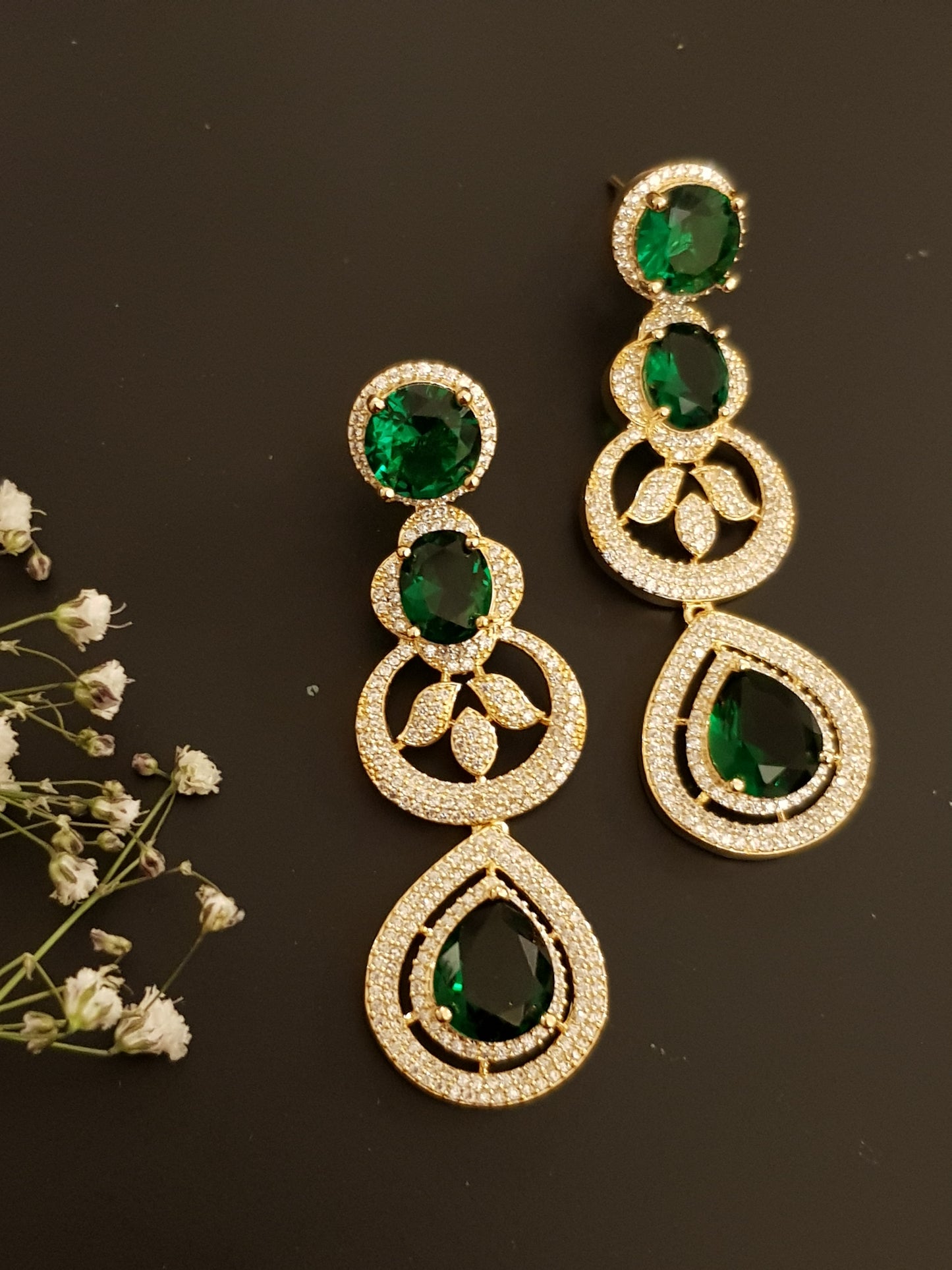 Gold finish set with long necklace in round CZ and emerald pieces, matching earrings