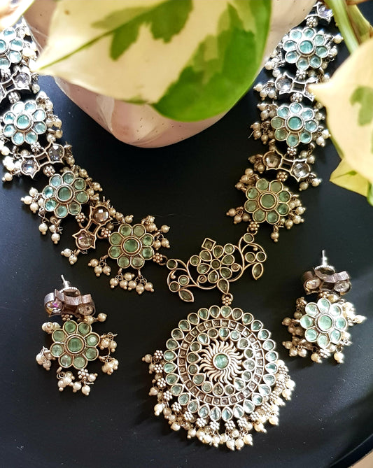 Antique silver finish set, flower motif long necklace with mint green stone inlay and pearl beads, matching earrings