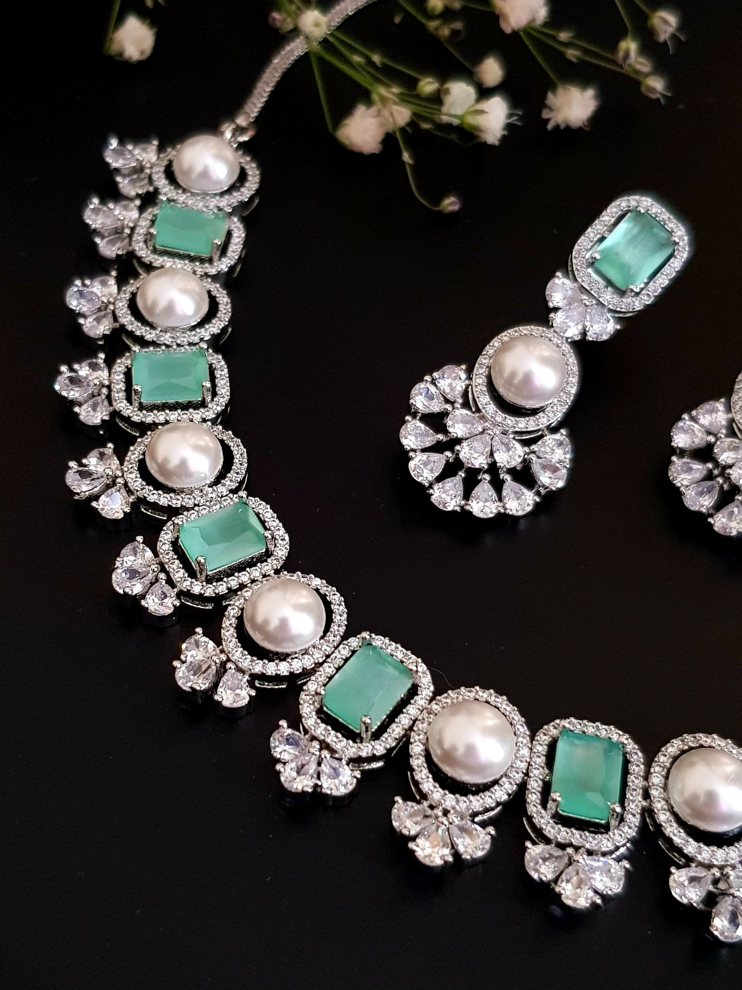 Elegant set with alternating pearls and stones set with with CZ detailing