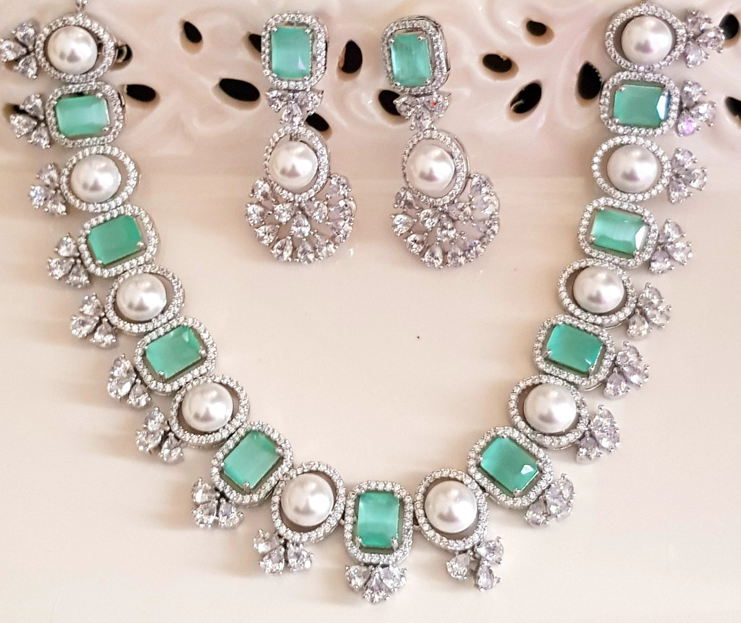 Elegant set with alternating pearls and stones set with with CZ detailing