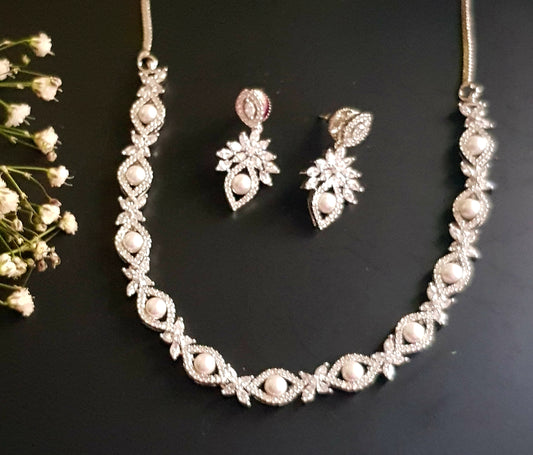 Platinum finish set, pearls with CZ around necklace, matching earrings