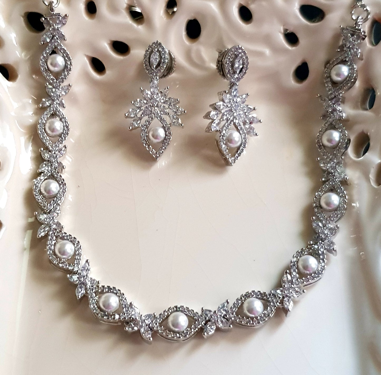 Platinum finish set, pearls with CZ around necklace, matching earrings