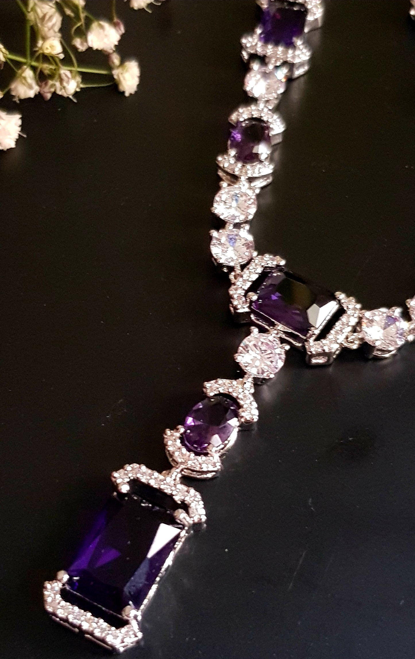 Platinum finish set, amethyst and CZ stones, set in single strand long necklace, matching earrings