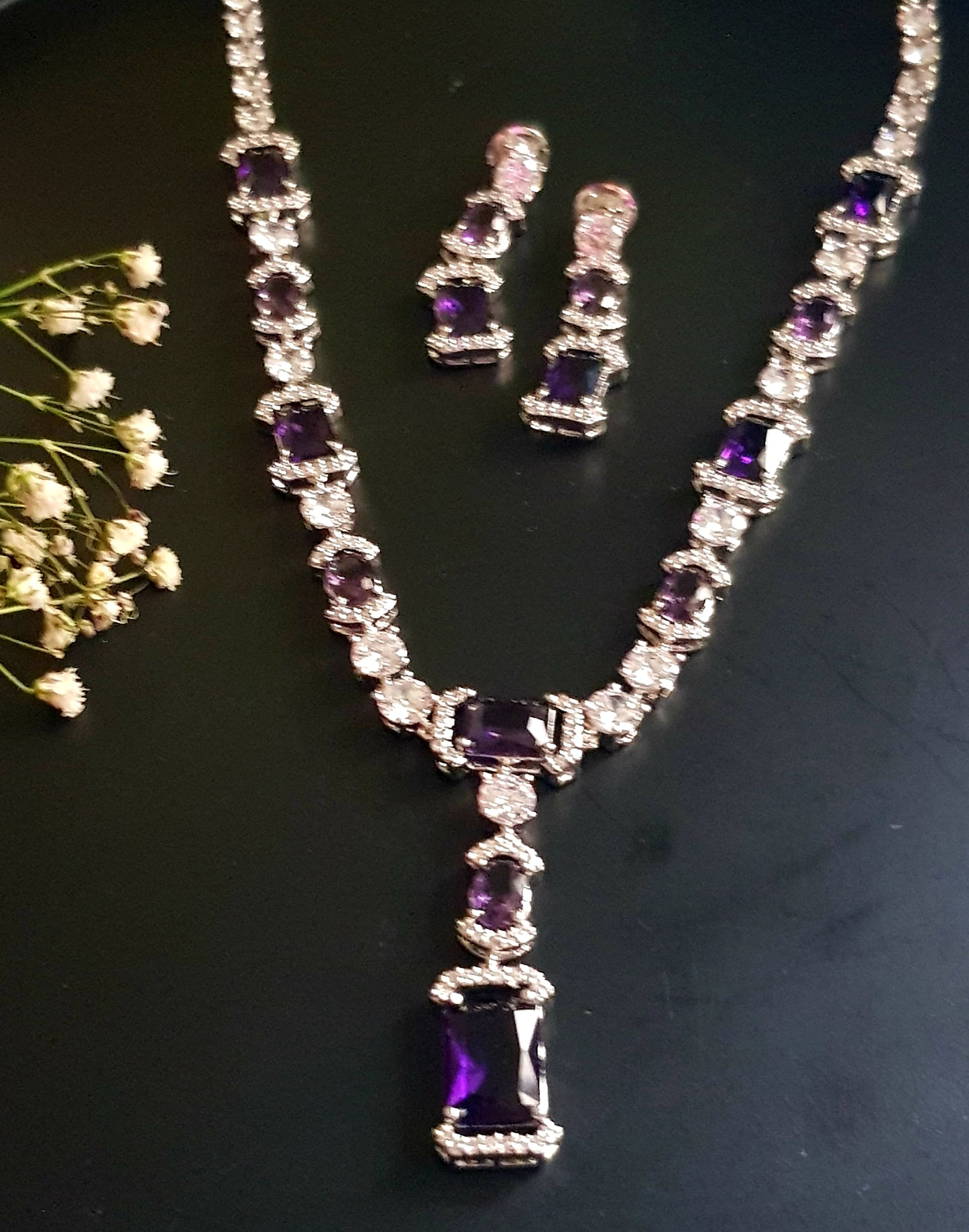 Platinum finish set, amethyst and CZ stones, set in single strand long necklace, matching earrings