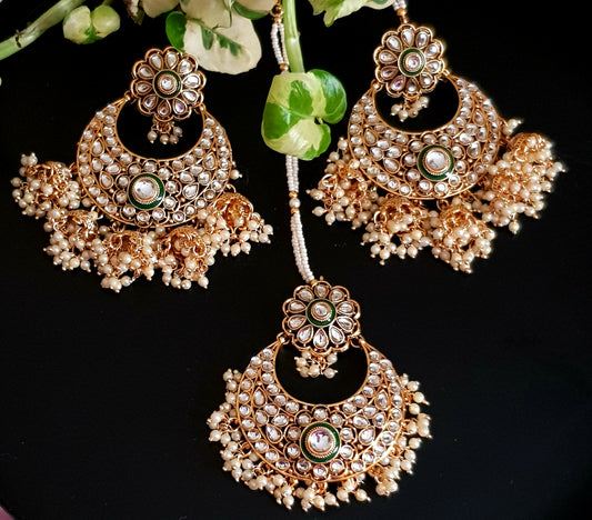 Gold finish big earrings in kundan and pearl with matching maangtika