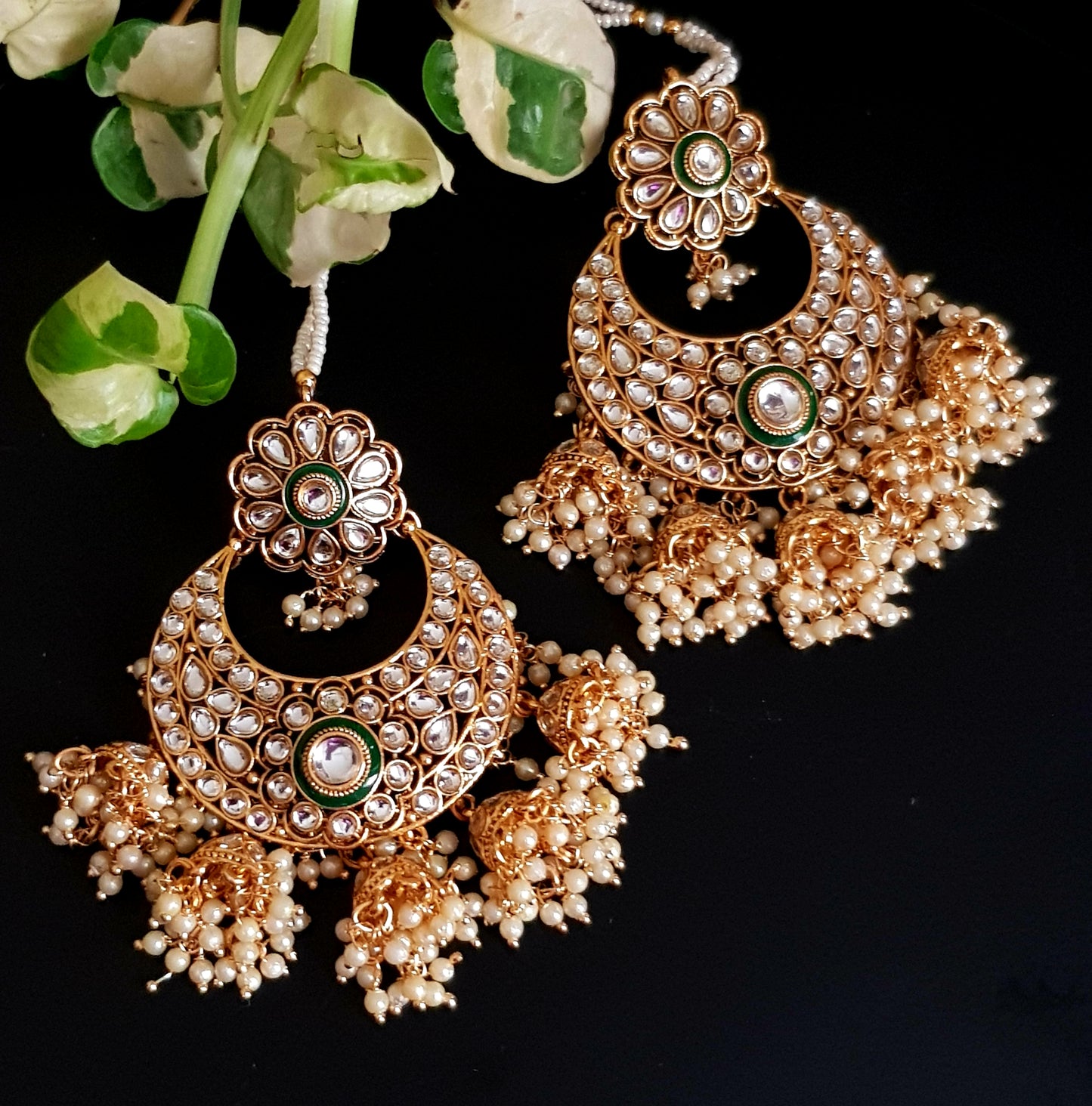 Gold finish big earrings in kundan and pearl with matching maangtika