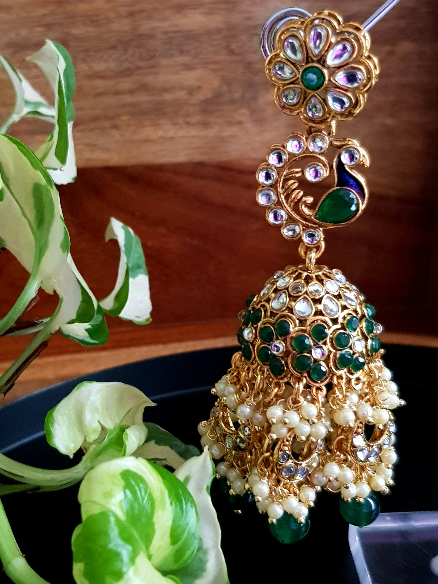 Long kundan and greenstone jhumki (earrings)