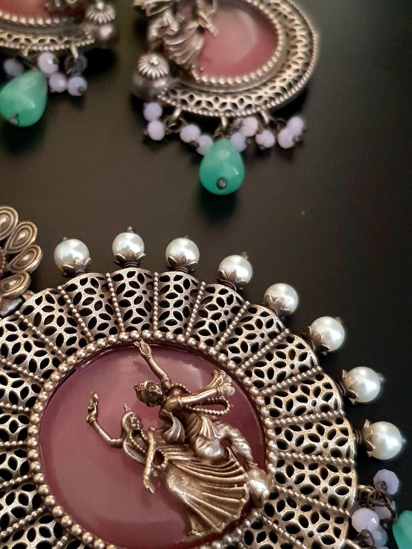 Silver finish set, dancing Radha-Krishna design over pink stone pendant with pearls, matching earrings