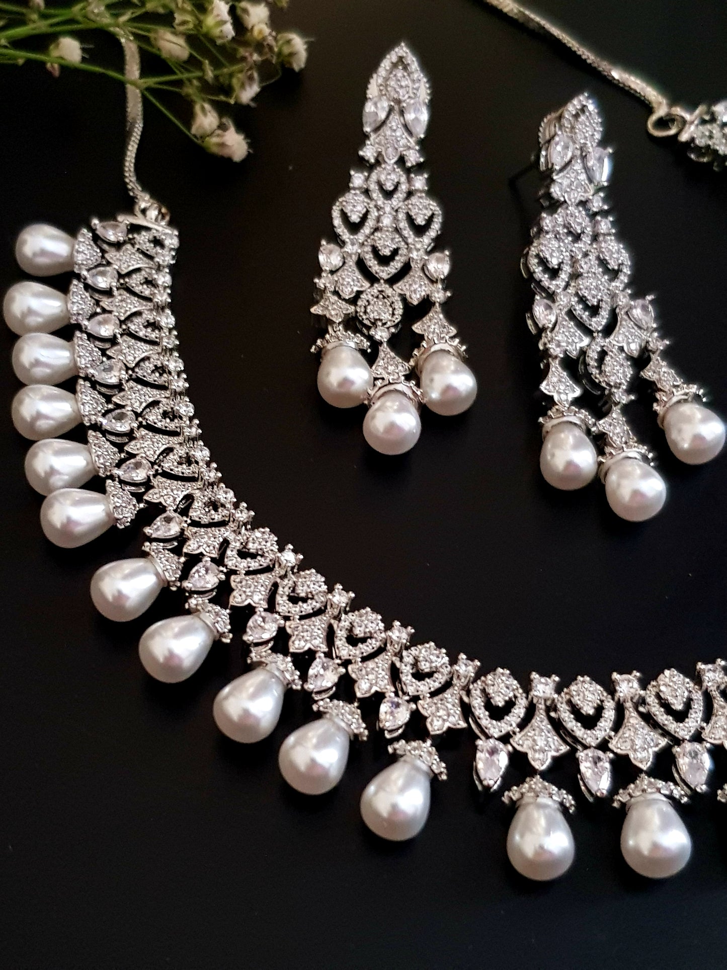 Platinum finish set in CZ and pearl drops , matching earrings